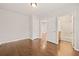 Bright bedroom with hardwood floors and ensuite bathroom with shower and tub combination at 789 Cooper Sw St, Atlanta, GA 30315