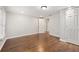 Unfurnished bedroom featuring hardwood floors, a window, and neutral paint, offering a blank canvas for personalization at 789 Cooper Sw St, Atlanta, GA 30315