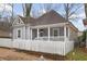 Cozy home featuring a white picket fence and a covered front porch at 789 Cooper Sw St, Atlanta, GA 30315