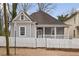 Charming home featuring a white picket fence and a welcoming front porch at 789 Cooper Sw St, Atlanta, GA 30315