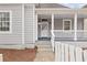 Inviting front porch with white railings and steps leading to the entrance at 789 Cooper Sw St, Atlanta, GA 30315