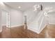 Bright hallway with hardwood floors and white staircase, creating an inviting entryway at 789 Cooper Sw St, Atlanta, GA 30315