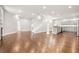 Open-concept living space with hardwood floors and a neutral color palette at 789 Cooper Sw St, Atlanta, GA 30315