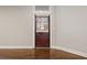 Bright living room with hardwood floors and a view of the front door and windows at 789 Cooper Sw St, Atlanta, GA 30315