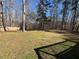 Expansive backyard with mature trees providing shade and privacy at 440 Ward Rd, Ellenwood, GA 30294