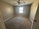 Cozy bedroom with carpeted floor and a window providing natural light at 440 Ward Rd, Ellenwood, GA 30294