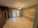 Bright dining area with tile floors and glass patio doors leading to the backyard at 440 Ward Rd, Ellenwood, GA 30294