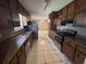 Functional kitchen with laminate countertops and floors, and ample cabinet space at 440 Ward Rd, Ellenwood, GA 30294