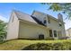 Two-story home showcasing the back exterior with a well-maintained lawn at 4832 Hidden Creek Pl, Decatur, GA 30035