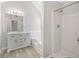 Bright bathroom featuring a vanity with marble countertop, bathtub, and a separate shower room at 4832 Hidden Creek Pl, Decatur, GA 30035