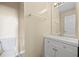 This bathroom features a white vanity, a toilet, and a framed mirror at 4832 Hidden Creek Pl, Decatur, GA 30035