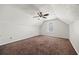 Spacious bedroom featuring neutral walls, carpet floors, a ceiling fan with light fixture, and a large window at 4832 Hidden Creek Pl, Decatur, GA 30035