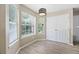 Breakfast nook features lots of natural light, a modern light fixture and closet space at 4832 Hidden Creek Pl, Decatur, GA 30035