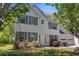 Charming two-story home with vinyl siding, gray shutters, landscaped yard, and an attached two car garage at 4832 Hidden Creek Pl, Decatur, GA 30035