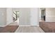 Hallway displaying flooring transition and access to other areas of the home at 4832 Hidden Creek Pl, Decatur, GA 30035