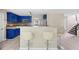 This modern kitchen features stainless steel appliances, a breakfast bar and blue cabinets at 4832 Hidden Creek Pl, Decatur, GA 30035