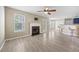 Open-concept living room features a fireplace, tile flooring and lots of natural light at 4832 Hidden Creek Pl, Decatur, GA 30035