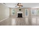 Open-concept living room features a fireplace, tile flooring and lots of natural light at 4832 Hidden Creek Pl, Decatur, GA 30035