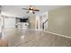 Open floor plan features tile flooring, a ceiling fan, and a view into the kitchen and staircase at 4832 Hidden Creek Pl, Decatur, GA 30035