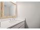Bathroom features a vanity with a decorative framed mirror and modern faucet at 505 Summer Ter, Woodstock, GA 30189