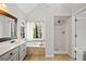 Bright bathroom with a tub, shower, double vanity, and a window at 505 Summer Ter, Woodstock, GA 30189
