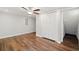 A large bedroom with a ceiling fan, closet, and hardwood floors at 505 Summer Ter, Woodstock, GA 30189