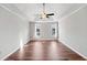 Empty bedroom features hardwood floors, a vaulted ceiling, and two windows that provide ample natural light at 505 Summer Ter, Woodstock, GA 30189