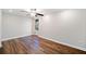 A spacious bedroom with hardwood floors, ceiling fan, and natural light at 505 Summer Ter, Woodstock, GA 30189
