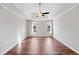 Spacious bedroom with tray ceilings, ceiling fan and hardwood floors, offering ample natural light at 505 Summer Ter, Woodstock, GA 30189