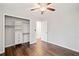 Bedroom with hardwood floors, neutral paint, and walk-in closet at 505 Summer Ter, Woodstock, GA 30189