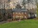 A lush green lawn makes for an inviting entrance to the two-story brick home at 505 Summer Ter, Woodstock, GA 30189
