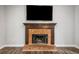 Living room with flat-screen TV above the fireplace, showcasing the cozy space at 505 Summer Ter, Woodstock, GA 30189