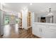 Spacious kitchen with island opens to other rooms, offering modern appliances and hardwood floors throughout at 505 Summer Ter, Woodstock, GA 30189
