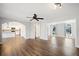 Spacious living room with hardwood floors, ceiling fan, and access to the kitchen at 505 Summer Ter, Woodstock, GA 30189