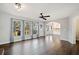 Inviting living room showcasing hardwood floors, natural light, and open access to the kitchen at 505 Summer Ter, Woodstock, GA 30189