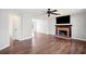 Comfortable living room with hardwood floors, fireplace, and a mounted television at 505 Summer Ter, Woodstock, GA 30189