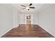 Spacious main bedroom with hardwood floors, tray ceiling, and ceiling fan at 505 Summer Ter, Woodstock, GA 30189