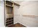 Walk-in closet with custom shelving and hanging rods at 505 Summer Ter, Woodstock, GA 30189