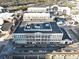 An aerial view shows the commercial building with rooftop features, surrounding roads, and parked cars, with nearby structures at 260 18Th Nw St # 10202, Atlanta, GA 30363