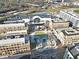 Expansive aerial view showcases commercial buildings, roads, and a shopping center with ample parking, capturing the urban landscape at 260 18Th Nw St # 10202, Atlanta, GA 30363