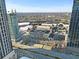 Wide aerial view reveals shopping center and urban environment with roads, buildings, and surrounding infrastructure, showcasing city at 260 18Th Nw St # 10202, Atlanta, GA 30363