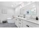 Elegant bathroom featuring double sinks, modern lighting, soaking tub, and a glass enclosed shower with white tile at 260 18Th Nw St # 10202, Atlanta, GA 30363