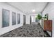 Hallway with unique art, elevator access, and a stylish cabinet at 260 18Th Nw St # 10202, Atlanta, GA 30363