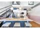 Open concept kitchen features a large island with barstool seating, stainless steel appliances, and hardwood floors at 260 18Th Nw St # 10202, Atlanta, GA 30363