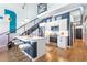 Modern kitchen includes stainless steel appliances, bar seating, and open staircase near the kitchen and dining area at 260 18Th Nw St # 10202, Atlanta, GA 30363