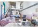 Comfortable living room with hardwood floors, modern furnishings, an open staircase, and modern kitchen in an open layout at 260 18Th Nw St # 10202, Atlanta, GA 30363