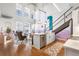 Bright living room features an open layout, modern kitchen island, high ceilings, and large windows for natural light at 260 18Th Nw St # 10202, Atlanta, GA 30363