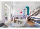 Bright and airy living room with stylish decor, including a plush sofa, marble coffee table, and modern art at 260 18Th Nw St # 10202, Atlanta, GA 30363