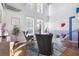 Chic living room showcasing high ceilings, large windows, hardwood floors, and modern decor with gray furniture at 260 18Th Nw St # 10202, Atlanta, GA 30363