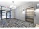 Elevator lobby featuring modern chandelier, clean design and adjacent exterior access at 260 18Th Nw St # 10202, Atlanta, GA 30363
